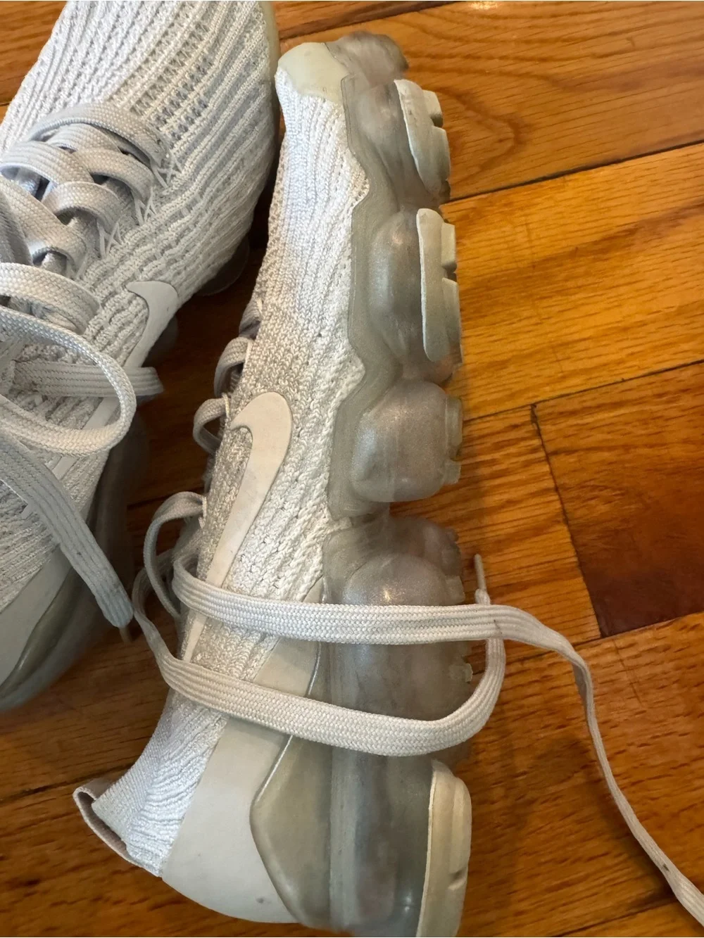 Nike Light Gray Knit Sneaker with Black Swoosh Detail